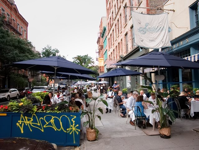 restaurant tables on sidewalk and street